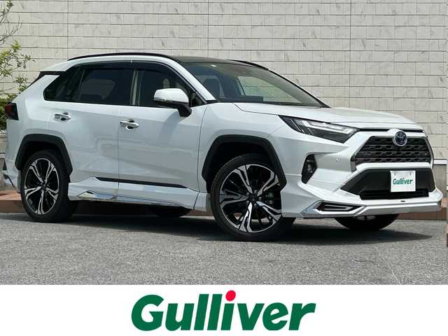 トヨタ ＲＡＶ４ ハイブリットG 滋賀県 2023(令5)年 5万km プラチナホワイトパールマイカ ガソリン（ハイブリッド）/4WD(F4)/CVT/モデリスタエアロ/モデリスタAW20インチ/パノラマムーンルーフ/純正10インチナビ/(AM/FM/BT/USB/フルセグTV)/黒革シート/ドラレコ一体型デジタルインナーミラー/ビルトインETC2.0/パノラミックビューモニター/ブラインドスポットモニター/トヨタセーフティセンス/・プリクラッシュセーフティ/・レーントレーシングアシスト/・オートマチックハイビーム/・レーダークルーズコントロール/コーナーセンサー/電動リアゲート/電動サイドブレーキ/ブレーキホールド/置くだけ充電/シートヒーター/シートベンチレーション/パワーシート/メモリーシート/革巻きステアリング/ステアリングスイッチ/ステアリングヒーター/オートライト/LEDヘッドライト/フロントフォグ/フルオートエアコン/寒冷地仕様/プッシュスタート/スマートキー/純正フロアマット/純正ドアバイザー/電格ウインカーミラー