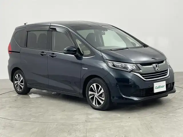 ホンダ フリード ハイブリット EX 愛知県 2018(平30)年 5.7万km フォレストグリーンパール 純正8インチメモリナビ/（フルセグTV/CD/DVD/BT）/バックカメラ/ハーフレザーシート/前席シートヒーター/ETC/ドラレコ/ワイパーデアイサー/衝突軽減システム/アダプティブクルーズコントロール/レーンキープアシスト/コーナーセンサー/両側パワスラ/純正LEDヘッドライト/純正フロアマット/純正15インチAW/ドアバイザー/エコノミーモード