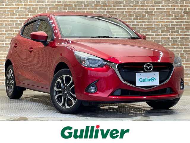 マツダ デミオ XD ツーリング Lパッケージ 秋田県 2015(平27)年 2.8万km ソウルレッドプレミアムメタリック ワンオーナー/４WD/ディーゼルターボ/スマートシティブレーキサポート/クルーズコントロール/ヘッドアップディスプレイ/横滑り防止装置/パドルシフト/アイドリングストップ/純正ナビ/フルセグTV/ステアリングスイッチ/バックカメラ/ETC/ドライブレコーダー/LEDヘッドライト/フォグランプ/純正16インチアルミホイール