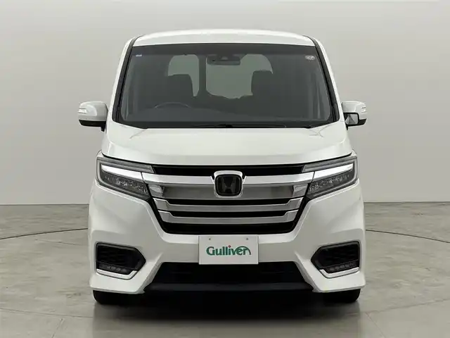 ホンダ ステップワゴン スパーダ eHEV G EXホンダS 福岡県 2021(令3)年 3.7万km プラチナホワイトパール 後席モニター　/社外10型ナビ/わくわくゲート　/ビルトインＥＴＣ２．０　/レーダークルーズコントロール　/ホンダセンシング　/衝突被害軽減ブレーキ　/レーンキープ　/先行車発進お知らせ　/標識認識機能　/両側電動スライドドア　/ハーフレザーシート　/シートヒーター　/純正16インチアルミホイール