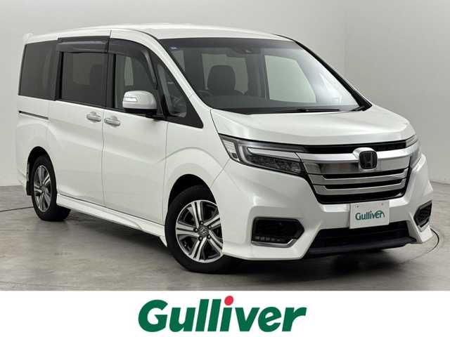 ホンダ ステップワゴン スパーダ eHEV G EXホンダS 福岡県 2021(令3)年 3.7万km プラチナホワイトパール 後席モニター　/社外10型ナビ/わくわくゲート　/ビルトインＥＴＣ２．０　/レーダークルーズコントロール　/ホンダセンシング　/衝突被害軽減ブレーキ　/レーンキープ　/先行車発進お知らせ　/標識認識機能　/両側電動スライドドア　/ハーフレザーシート　/シートヒーター　/純正16インチアルミホイール