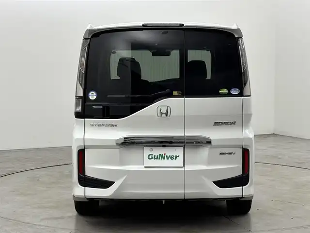 ホンダ ステップワゴン スパーダ eHEV G EXホンダS 福岡県 2021(令3)年 3.7万km プラチナホワイトパール 後席モニター　/社外10型ナビ/わくわくゲート　/ビルトインＥＴＣ２．０　/レーダークルーズコントロール　/ホンダセンシング　/衝突被害軽減ブレーキ　/レーンキープ　/先行車発進お知らせ　/標識認識機能　/両側電動スライドドア　/ハーフレザーシート　/シートヒーター　/純正16インチアルミホイール