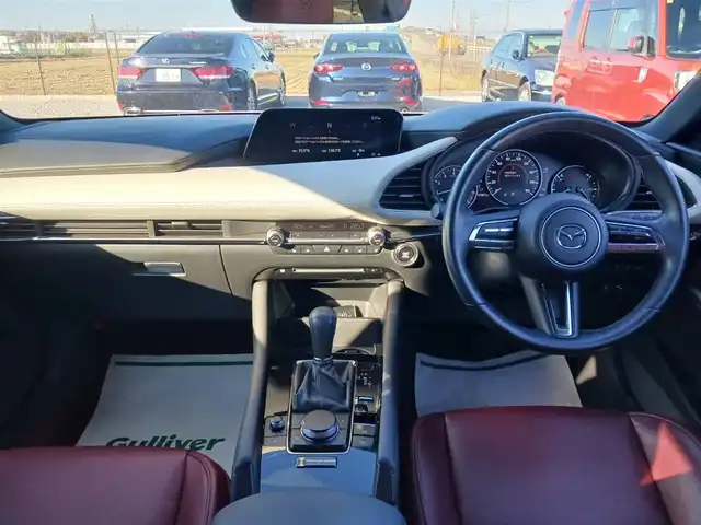 マツダ マツダ３ファストバック 20S 100周年特別記念車 宮崎県 2021(令3)年 4.4万km ソウルレッドクリスタルM 純正8.8型ナビ/フルセグTV/BOSEサウンドシステム/360度ビューモニター/ビルトインETC/レーダークルーズコントロール/前後パーキングセンサー/衝突被害軽減ブレーキ/車線逸脱防止支援システム/ブラインドスポットモニタリング/AT誤発進抑制/交通標識認識/ヘッドアップディスプレイ/LEDヘッドランプ/革巻きステアリング/ステアリングヒーター/パドルシフト/レッド革シート/前席シートヒーター/運転席パワーシート/純正18インチアルミホイール/スマートキー/プッシュエンジンスタート/禁煙車