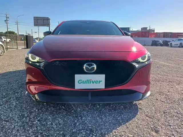 マツダ マツダ３ファストバック 20S 100周年特別記念車 宮崎県 2021(令3)年 4.4万km ソウルレッドクリスタルM 純正8.8型ナビ/フルセグTV/BOSEサウンドシステム/360度ビューモニター/ビルトインETC/レーダークルーズコントロール/前後パーキングセンサー/衝突被害軽減ブレーキ/車線逸脱防止支援システム/ブラインドスポットモニタリング/AT誤発進抑制/交通標識認識/ヘッドアップディスプレイ/LEDヘッドランプ/革巻きステアリング/ステアリングヒーター/パドルシフト/レッド革シート/前席シートヒーター/運転席パワーシート/純正18インチアルミホイール/スマートキー/プッシュエンジンスタート/禁煙車