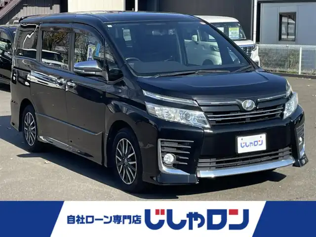 トヨタ ヴォクシー ZS 煌 宮城県 2015(平27)年 14.4万km ブラック (株)IDOMが運営する【じしゃロン仙台店】の自社ローン専用車両になりますこちらは現金またはオートローンご利用時の価格です。自社ローンご希望の方は別途その旨お申付け下さい/両側パワースライドドア/メモリナビ/後席モニター/フルセグ/Bluetooth/バックカメラ/CD/DVD/ビルトインETC/前後ドラレコ/ASSURAレーダー/LEDヘッドライト/純正16インチAW