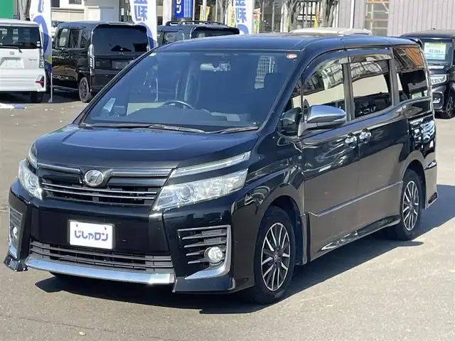 トヨタ ヴォクシー ZS 煌 宮城県 2015(平27)年 14.4万km ブラック (株)IDOMが運営する【じしゃロン仙台店】の自社ローン専用車両になりますこちらは現金またはオートローンご利用時の価格です。自社ローンご希望の方は別途その旨お申付け下さい/両側パワースライドドア/メモリナビ/後席モニター/フルセグ/Bluetooth/バックカメラ/CD/DVD/ビルトインETC/前後ドラレコ/ASSURAレーダー/LEDヘッドライト/純正16インチAW