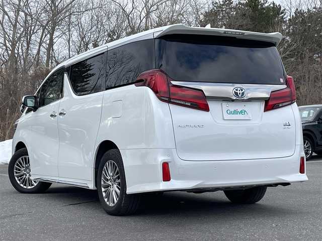 トヨタ アルファードハイブリット S タイプゴールドⅡ 静岡県 2021(令3)年 6.1万km ホワイトパールクリスタルシャイン ワンオーナー/4WD/トヨタセーフティセンス/・プリクラッシュセーフティ/・レーダークルーズコントロール/・レーンディパーチャーアラート/・オートハイビーム/ブラインドスポットモニタリング/前後クリアランスソナー/純正メモリナビ/　 AM/FM/BT/TV/バックカメラ/両側パワースライドドア/パワーバックドア/ハーフレザーシート/オットマン/LEDオートライト/フォグランプ/純正17インチアルミホイール/アイドリングストップ/100V電源/ステアリングスイッチ/デジタルインナーミラー/スマートキー/ビルトインETC2.0
