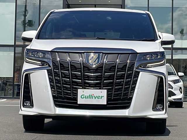 トヨタ アルファードハイブリット S タイプゴールドⅡ 青森県 2021(令3)年 6.2万km ホワイトパールクリスタルシャイン ・4WD/・トヨタセーフティセンス/・プリクラッシュセーフティ/・レーダークルーズコントロール/・レーンディパーチャーアラート/・オートハイビーム/・ブラインドスポットモニタリング/・前後クリアランスソナー/・純正メモリナビ/・フルセグ/・バックカメラ/・両側パワースライドドア/・パワーバックドア/・ハーフレザーシート/・オットマン/・LEDオートライト/・フォグランプ/・純正17インチアルミホイール/・アイドリングストップ/・100V電源/・ステアリングスイッチ/・デジタルインナーミラー/・スマートキー/・ビルトインETC2.0