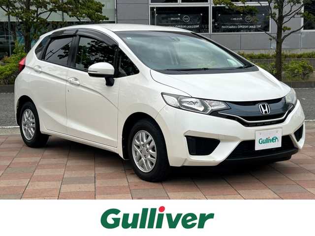 ホンダ フィット 13G Fパッケージ 福島県 2015(平27)年 5.7万km プレミアムホワイトパール 社外ナビゲーション/型番：CN-R300D/【CD/DVD/SD/BT/TV】/バックカメラ/ビルトインETC/アイドリングストップ/純正フロアマット/ドアバイザー
