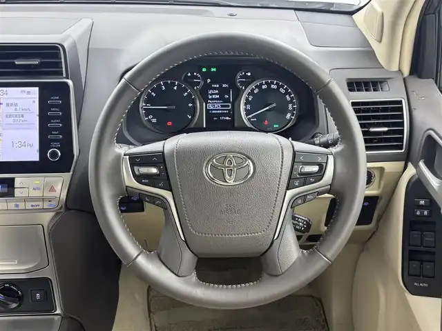 トヨタ ランドクルーザー プラド TX Lパッケージ 福井県 2023(令5)年 1.8万km ホワイトパールクリスタルシャイン 純正ディスプレイオーディオ/アラウンドビューモニター/スペアキー/サンルーフ/モデリスタエアロ（フロント＆リア）/純正１９インチＯＰアルミホイール/寒冷地仕様/ニュートラルベージュシート/シートヒーター＆ベンチレーション/ルーフレール/ドラレコ前後（SD欠）/保証書＆取説/純正ビルトインETC