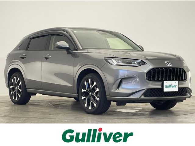 ホンダ ＺＲ－Ｖ ハイブリッド e:HEV Z 滋賀県 2023(令5)年 1.8万km スーパープラチナグレーメタリック ９インチホンダコネクトナビ/Bluetooth/フルセグTV/ホンダセンシング/渋滞追従機能付きアダプティブクルーズコントロール/車線維持支援システム/衝突被害軽減ブレーキ/路外逸脱抑制機能/標識認識機能/ブラインドスポットインフォメーション/パーキングセンサーシステム/後退出庫サポート/BOSEスピーカー/パドルシフト/全方位カメラ/純正ETC2.0/ワイヤレス充電/オートホールド/パワーシート/シートヒーター/ステアリングヒーター/パワーバックドア/LEDヘッドライト