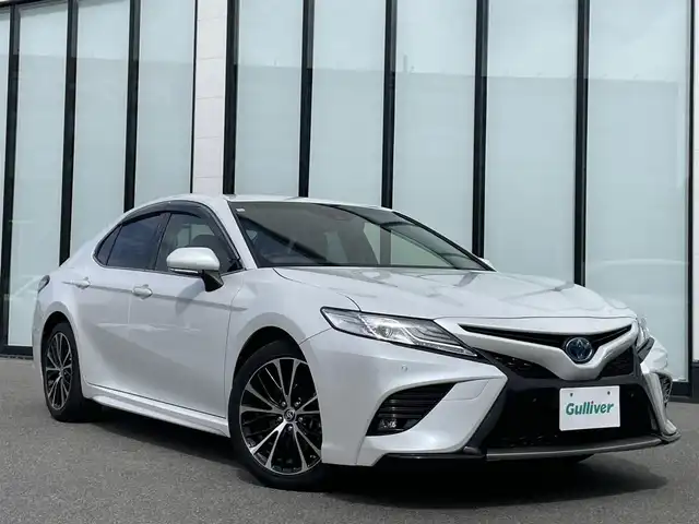 トヨタ カムリ WSレザーパッケージ 大阪府 2020(令2)年 6.5万km プラチナホワイトパールマイカ ワンオーナー　/純正８インチディスプレイオーディオ　/   フルセグＴＶ/Bluetooth/USB　/バックモニター/クリアランスソナー/ブラインドスポットモニター　/ヘッドアップディスプレイ/トヨタセーフティセンス　/前席シートヒーター　/パドルシフト　/前席パワーシート/レザーシート/前後ドライブレコーダー/純正18インチアルミホイール/純正フロアマット　/ビルトインＥＴＣ　/ＬＥＤ