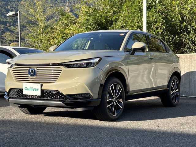 ホンダ ヴェゼル ハイブリッド e:HEV Z 長崎県 2024(令6)年 3.5万km ベージュ プッシュスタート/純正ナビ付ディスプレイオーディオ（AM/FM/USB/TV)/電子パーキングブレーキ/ビルトインETC2.0/USB×２/ブレーキホールド/ドライブレコーダー（前後）/パドルシフト/シートヒーター（前席）/ハンドルヒーター/ブラインドスポットモニター/クルーズコントロール（追従あり）/レーンキープアシスト/ブルートゥース/コーナーセンサー（前後）/カーテンエアバッグ/パワーバックドア/LEDライト/フォグランプ