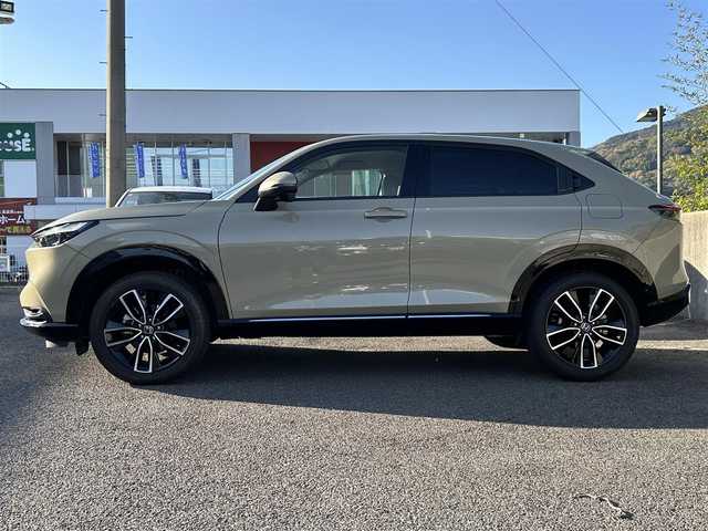 ホンダ ヴェゼル ハイブリッド e:HEV Z 長崎県 2024(令6)年 3.5万km ベージュ プッシュスタート/純正ナビ付ディスプレイオーディオ（AM/FM/USB/TV)/電子パーキングブレーキ/ビルトインETC2.0/USB×２/ブレーキホールド/ドライブレコーダー（前後）/パドルシフト/シートヒーター（前席）/ハンドルヒーター/ブラインドスポットモニター/クルーズコントロール（追従あり）/レーンキープアシスト/ブルートゥース/コーナーセンサー（前後）/カーテンエアバッグ/パワーバックドア/LEDライト/フォグランプ