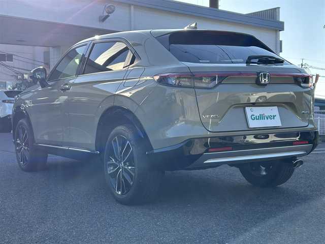 ホンダ ヴェゼル ハイブリッド e:HEV Z 長崎県 2024(令6)年 3.5万km ベージュ プッシュスタート/純正ナビ付ディスプレイオーディオ（AM/FM/USB/TV)/電子パーキングブレーキ/ビルトインETC2.0/USB×２/ブレーキホールド/ドライブレコーダー（前後）/パドルシフト/シートヒーター（前席）/ハンドルヒーター/ブラインドスポットモニター/クルーズコントロール（追従あり）/レーンキープアシスト/ブルートゥース/コーナーセンサー（前後）/カーテンエアバッグ/パワーバックドア/LEDライト/フォグランプ