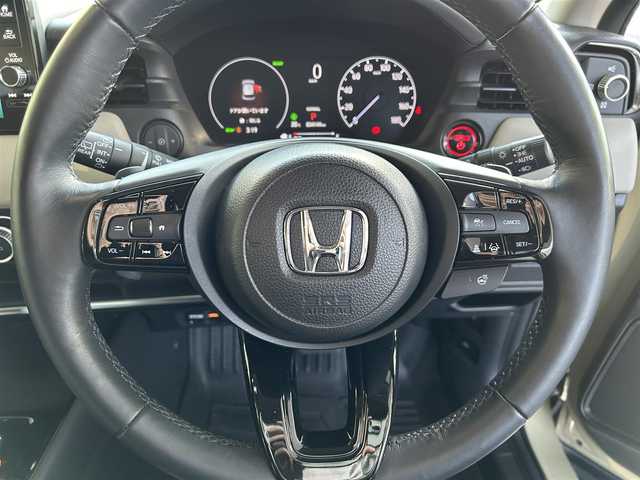 ホンダ ヴェゼル ハイブリッド e:HEV Z 長崎県 2024(令6)年 3.5万km ベージュ プッシュスタート/純正ナビ付ディスプレイオーディオ（AM/FM/USB/TV)/電子パーキングブレーキ/ビルトインETC2.0/USB×２/ブレーキホールド/ドライブレコーダー（前後）/パドルシフト/シートヒーター（前席）/ハンドルヒーター/ブラインドスポットモニター/クルーズコントロール（追従あり）/レーンキープアシスト/ブルートゥース/コーナーセンサー（前後）/カーテンエアバッグ/パワーバックドア/LEDライト/フォグランプ