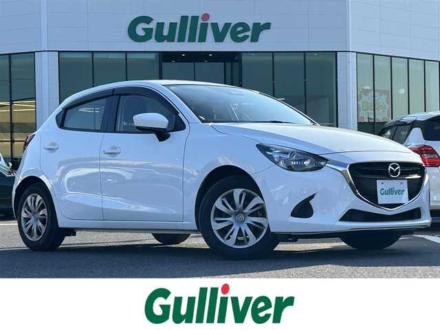 マツダ デミオ 15C 島根県 2018(平30)年 7.5万km アークティックホワイト 登録時走行距離74496km/レーンキープアシスト/衝突被害軽減ブレーキ/前後コーナーセンサー/AUXカーオーディオ/W+サイドエアバッグ/プッシュスタート/スペアキー/15インチ純正アルミ/横滑り防止装置