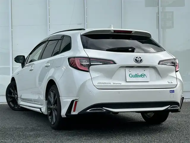 トヨタ カローラツーリング ハイブリッド ダブルバイビー 福岡県 2020(令2)年 4.7万km ホワイトパールクリスタルシャイン ・MODELISTAフルエアロ/・純正ナビ（TV/Bluetooth/Miracast）/・バックカメラ/・ドライブレコーダー（PORMIDO/前後）/・ETC2.0/・トヨタクリアランスソナー/・クルーズコントロール（追従可能）/・レーンキープアシスト/・横滑り防止装置/・衝突被害軽減システム/・D/N席シートヒーター/・オートマチックハイビーム/・LEDヘッドライト/・フットランプ/・ワイヤレス充電/・電動パーキングブレーキ/・ヒートステアリング/・ステアリングスイッチ/・電格ミラー/・トノカバー