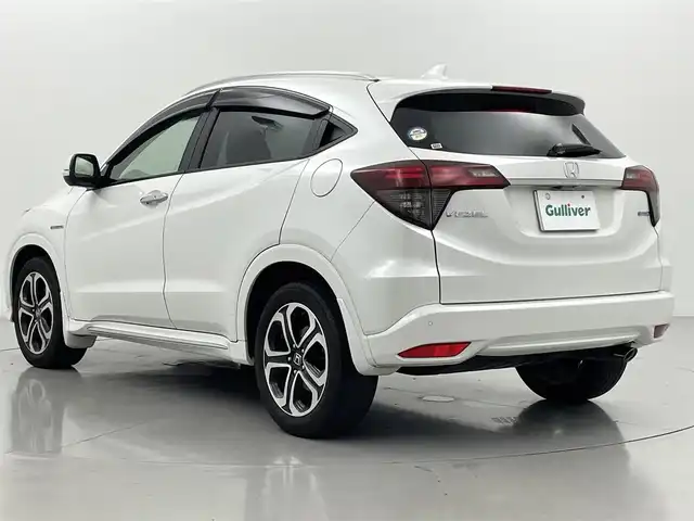 ホンダ ヴェゼル ハイブリッド Z ホンダセンシング 熊本県 2018(平30)年 6.1万km プラチナホワイトパール ワンオーナー　/禁煙車　/純正ナビ（ＣＤ・ＤＶＤ・フルセグ・ＢＴ・ＳＤ・ＵＳＢ・HDMI）/バックカメラ　/ビルトインＥＴＣ　/社外前方ドライブレコーダー　/レーダークルーズコントロール/前後クリアランスソナー　/前席シートヒーター/ハーフレザーシート/純正フロアマット/純正１７インチAW/オートライト/LEDヘッドライト/フォグライト/スマートキー/プッシュスタート/スペアキー1本/保証書/取扱説明書