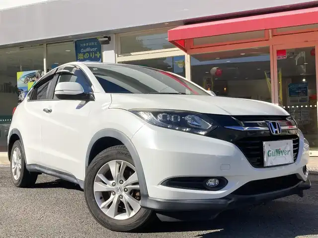 ホンダ ヴェゼル X 長崎県 2015(平27)年 15.3万km ホワイトオーキッドパール 衝突被害軽減ブレーキ/メーカーOPナビ/・Bluetooth接続/・フルセグTV/・DVD再生/バックカメラ/ビルトインETC/クルーズコントロール/革巻きステアリング/ステアリングスイッチ/電子パーキング/オートホールド機能/ECON/ISOFIX/LEDオートヘッドライト/USB接続/HDIM接続