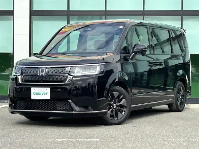 ホンダ ステップワゴン スパーダ eHEV 和歌山県 2023(令5)年 1.3万km クリスタルブラックパール 純正ナビ/全方位モニター/フルセグTV/両側パワースライドドア/衝突軽減ブレーキ/アダプティブクルーズコントロール/コーナーセンサー/パワーテールゲート/シートヒーター/純正アルミホイール/純正フロアマット/ビルトインETC/ドライブレコーダー/LEDヘッドライト/オートライト