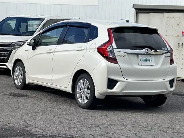 ホンダ フィット ハイブリット Lパッケージ 福島県 2015(平27)年 15.6万km プレミアムホワイトパール 純正ナビ/バックカメラ/フルセグテレビ/Bluetooth接続/クルーズコントロール/オートライト/キセノンライト/フォグランプ/保証書/ワンオーナー