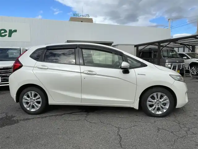 ホンダ フィット ハイブリット Lパッケージ 福島県 2015(平27)年 15.6万km プレミアムホワイトパール 純正ナビ/バックカメラ/フルセグテレビ/Bluetooth接続/クルーズコントロール/オートライト/キセノンライト/フォグランプ/保証書/ワンオーナー