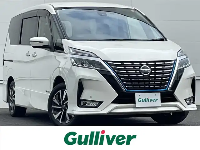 日産 セレナ e－パワー ハイウェイスター V 佐賀県 2021(令3)年 7.8万km ブリリアントホワイトパール 7人乗り/プロパイロット/インテリジェントルームミラー/エマージェンシーブレーキ/インテリジェントクルーズコントロール/車線逸脱警報/車線逸脱防止支援/側方支援/後側方支援/前後ソナー/純正10型SDナビ/・アラウンドビューカメラ/・フルセグTV/BT/CD/DVD/純正後席モニター/TVキャンセラー/両側パワースライドドア/純正16インチAW/LEDヘッドライト/オートライト/シートヒーター/ステアリングヒーター/スペアキー×１/取扱説明書/保証書オットマン