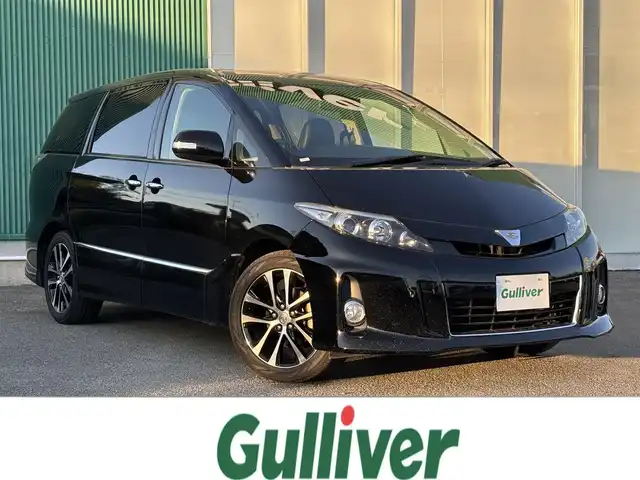 トヨタ エスティマ アエラス プレミアムエディション 福岡県 2014(平26)年 7.5万km ブラック カロッツェリアナビ/フルセグTV/両側パワースライドドア/バックモニター/ビルトインETC/ドライブレコーダー/パイオニア10型フリップダウンモニター/クルーズコントロール/HIDヘッドランプ/オートライト/オートエアコン/リアクーラー/革巻きステアリング/ステアリングスイッチ/ハーフレザーシート/運転席パワーシート/純正18インチアルミホイール/スマートキー/プッシュエンジンスタート/禁煙車