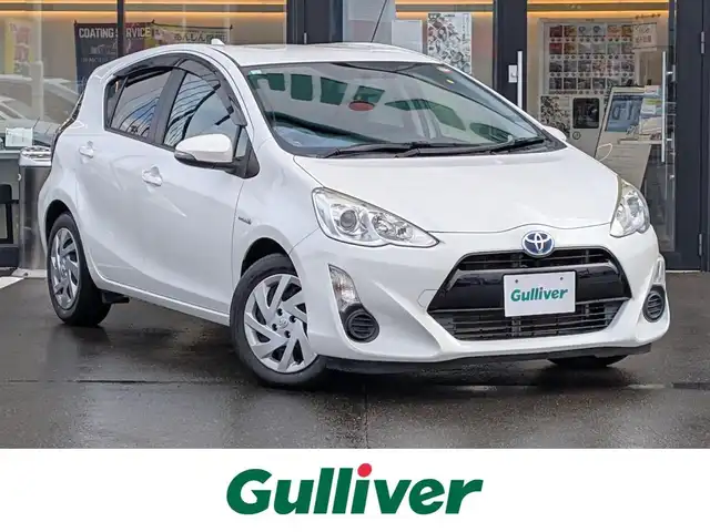 トヨタ アクア S 福井県 2015(平27)年 6万km ライムホワイトパールクリスタルシャイン 純正SDナビ/AM/FM/ワンセグ/BT/CD/AUX/バックカメラ/アイドリングストップ/横滑り防止装置/ETC/ダブルエアバッグ/純正フロアマット/LEDヘッドライト/オートライト/純正ホイルキャップ/スマートキー