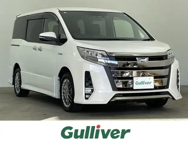 トヨタ ノア ハイブリッド Si ダブルバイビーⅡ 千葉県 2019(平31)年 5.8万km ホワイトパールクリスタルシャイン 禁煙車/トヨタセーフティセンス/・先行車発進お知らせ/・レーンディパーチャーアラート/・クリアランスソナー/・クルーズコントロール/両側パワースライドドア/純正１０型メモリナビ/・型番：NSZN-Z68T/・CD/DVD/Bluetooth/フルセグTV/・バックカメラ/・ビルトインETC/革巻きステアリング/・ステアリングスイッチ/ハーフレザーシート/・DNシートヒーター/左右独立エアコン/純正フロアマット/純正ドアバイザー/純正１６インチAW/オートライト/・オートマチックハイビーム/・LEDヘッドライト/・LEDフォグランプ