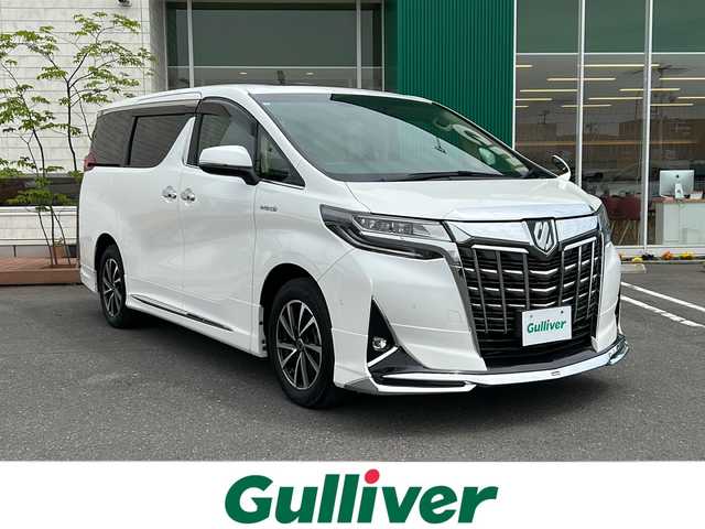 トヨタ アルファードハイブリット X 青森県 2019(平31)年 4.2万km ホワイトパールクリスタルシャイン 4WD/TコネクトSDナビ・フルセグTV/JBLプレミアムサウンド/CD・DVD・Bluetooth・SD/ツインムーンルーフ/OPインテリジェントパーキングアシスト2/OPデジタルインナーミラー/両側パワースライドドア/セーフティセンス/プリクラッシュセーフティ/レーダークルーズコントロール/レーントレーシングアシスト/オートマチックハイビーム/ロードサインアシスト/OPブラインドスポットモニター/前後ドライブレコーダー/AC100V100W/ビルトインETC2.0/LEDヘッドライト/LEDフォグライト/社外17インチアルミ/モデリスタエアロ