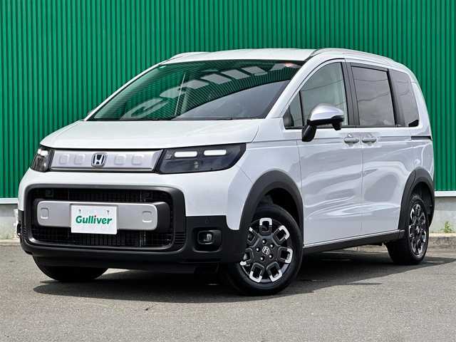 ホンダ フリード ハイブリット e:HEV クロスター 宮城県 2025(令7)年 0.1万km未満 プラチナホワイトパール 2列目キャプテンシート/リアクーラー/＝＝＝/ホンダセンシング/●衝突軽減ブレーキ（CMBS）/●先行車発進お知らせ機能/●歩行者事故低減ステアリング/●路外逸脱抑制機能/●標識認識機能/●渋滞追従機能付アダプティブクルーズコントロール（ACC）/●車線維持支援システム（LKAS）/●トラフィックジャムアシスト（渋滞運転支援機能）/●ブラインドスポットインフォメーション/●誤発進抑制機能/●後方誤発進抑制機能/●近距離衝突軽減ブレーキ/●急アクセル抑制機能/●パーキングセンサーシステム/●オートハイビーム/コンフォートビューパッケージ/純正9インチナビ（LXM-242ZFNI）/・Bluetooth/・AppleCarPlay/AndroidAuto/・フルセグTV/バックカメラ/両側パワースライドドア/ハーフレザーシート/前席シートヒーター/革巻きステアリング/LEDヘッドランプ/フォグランプ/オートライト/スマートキー＆プッシュスタート/スペアキー/電動格納ミラー/ルーフレール/純正15インチAW/W/サイド/カーテンエアバッグ
