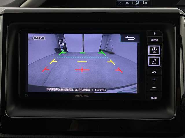 トヨタ ヴォクシー ZS 煌 新潟県 2015(平27)年 6.5万km アイスチタニウムマイカメタリック 禁煙車/4WD/社外メモリナビ/フルセグ/　CD/DVD/Bluetooth/社外フリップダウンモニター/バックカメラ/両側パワースライドドア/スマートキー/純正エンジンスターター/LEDヘッドライト/オートライト/フォグランプ/革巻きステアリング/ワイパーデアイサー/プッシュスタート/ETC/社外アルミ付きスタッドレス/　（積み込み６mm）