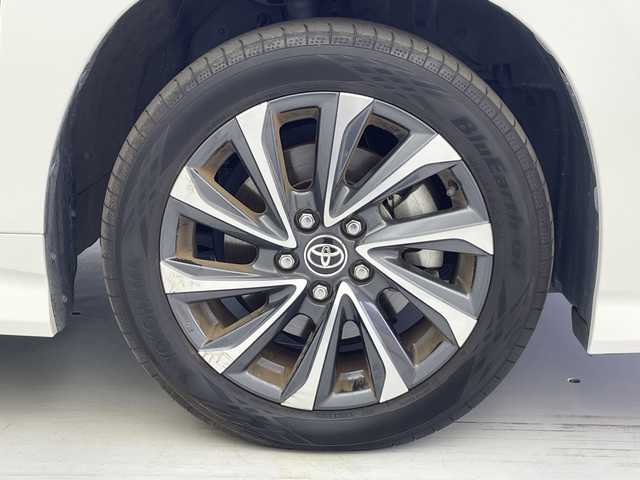 トヨタ ヴォクシー S－Z 愛知県 2023(令5)年 2.9万km ホワイトパールクリスタルシャイン 純正10.5インチナビ（AM/FM/BT/CD/DVD/フルセグTV/HDMI）/フリップダウンモニター/両側パワースライドドア/レーダークルーズコントロール/バックカメラ/前席シートヒーター/クリアランスソナー/ビルトインETC/RSA（ロードサインアシスト）/PDA（プロアクティブドライビングアシスト）/PKSB（パーキングサポートブレーキ）/PCS（プリクラッシュセーフティ）/両側パワースライドドア/USB入力端子/オートライト/オートマチックハイビーム/横滑り防止装置/フロアマット/純正17インチアルミホイール/取扱説明書