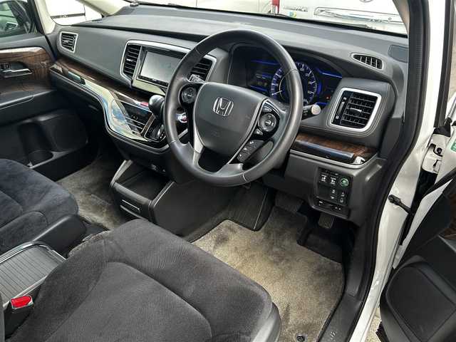 ホンダ オデッセイ ハイブリッド EX　パッケージ 滋賀県 2016(平28)年 7.1万km ホワイトオーキッドパール 社外7インチナビ/【Bluetooth/DVD/CD/フルセグTV】/両側パワースライドドア/ホンダセンシング/・衝突軽減ブレーキ 〈CMBS〉/・歩行者事故低減ステアリング/・アダプティブクルーズコントロール/・LKAS 〈車線維持支援システム〉/・路外逸脱抑制機能/・誤発進抑制機能/・先行車発進お知らせ機能/・標識認識機能/バックカメラ/純正フリップダウンモニター/AC100V電源/ビルトイン純正ETC/LEDヘッドライト/エンジンスターター/純正フロアマット/D席パワーシート/コンフォートビューパッケージ/二列目オットマン/ステアリングリモコン/スマートキー/プッシュスタート