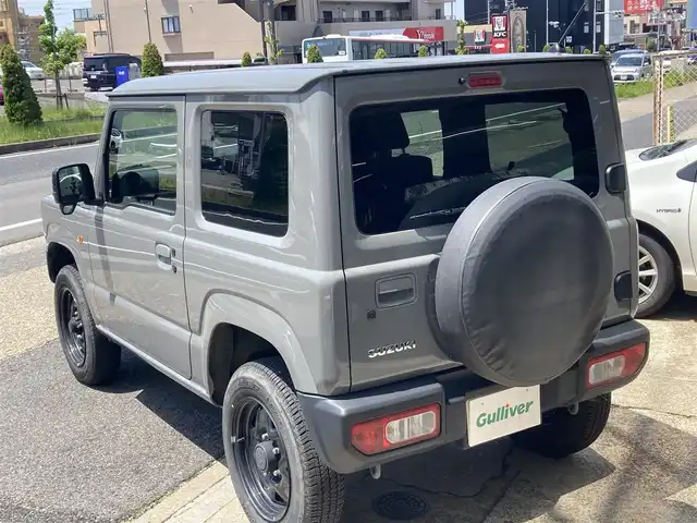 スズキ ジムニー XL 佐賀県 2021(令3)年 2.3万km ミディアムグレー 禁煙車/ワンオーナー車/スズキセーフティサポート/社外CDオーディオ/ Bluetooth/USB/AUX/CD/FM/AM/シートヒーター/横滑り防止装置/ヒーテッドドアミラー/電動格納ミラー/ヘッドライトレベライザー/スマートキー2個/AUTOライト/フォグランプ/車両取扱説明書/新車時保証書
