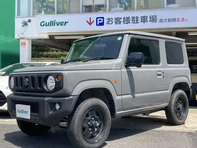 スズキ ジムニー XL 佐賀県 2021(令3)年 2.3万km ミディアムグレー 禁煙車/ワンオーナー車/スズキセーフティサポート/社外CDオーディオ/ Bluetooth/USB/AUX/CD/FM/AM/シートヒーター/横滑り防止装置/ヒーテッドドアミラー/電動格納ミラー/ヘッドライトレベライザー/スマートキー2個/AUTOライト/フォグランプ/車両取扱説明書/新車時保証書