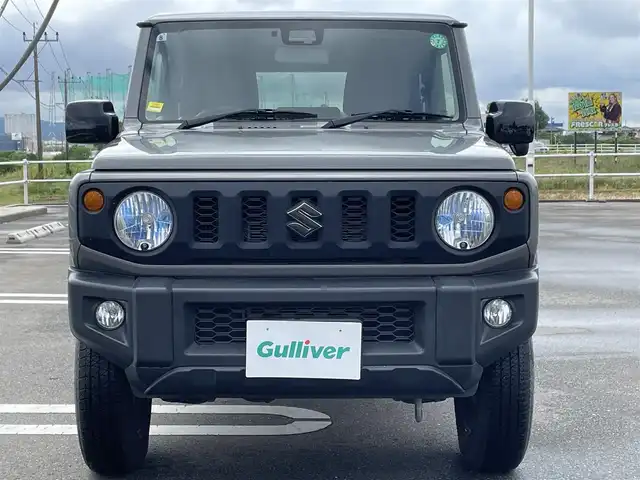 スズキ ジムニー XL 佐賀県 2021(令3)年 2.3万km ミディアムグレー ワンオーナー/パートタイム４WD/５速MTミッション/衝突被害軽減ブレーキ/車線逸脱警報/横滑り防止装置/社外オーディオ/・AM/FM/CD/USB/Bluetooth/ビルトインETC/D+N席シートヒーター/ミラーヒーター/プッシュスタート/スマートキー/純正フォグライト/純正フロアマット/新車保証書/取扱説明書/スペアキー１本