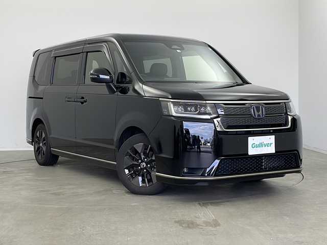 ホンダ ステップワゴン スパーダ eHEV 新潟県 2022(令4)年 4.5万km クリスタルブラックパール 純正9インチナビ/(LXM-237VFNi)/(CD.DVD.SD.フルセグ.Bluetooth.HDMI)/純正フリップダウンモニター/バックカメラ/ホンダセンシング/レーダークルーズコントロール/レーンキープアシスト/ブラインドスポットモニター/革巻きステアリング/ステアリングリモコン/LEDオートライト/フォグランプ/両側パワースライドドア/パワーバックドア/ETC/プッシュスタート/スマートキー/純正フロアマット
