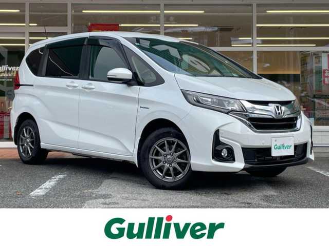 ホンダ フリード ハイブリット G ホンダセンシング 岐阜県 2017(平29)年 9.8万km ホワイトオーキッドパール ワンオーナー/4WD/両側パワースライドドア/後席モニター/ナビ/【Bluetooth．CD.TV.AM/FM】/バックカメラ/レザーシート/シートヒーター/コーナーセンサー/衝突被害軽減システム/レーンキープアシスト/クルーズコントロール/ETC/ドライブレコーダー/純正フロアマット/電動格納ドアミラー/ウィンカーミラー/ドアバイザー/サンシェード/横滑り防止装置/保証書/取扱説明書/スペアキー