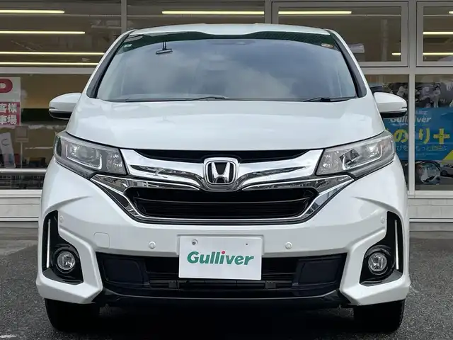 ホンダ フリード ハイブリット G ホンダセンシング 岐阜県 2017(平29)年 9.8万km ホワイトオーキッドパール ワンオーナー/4WD/両側パワースライドドア/後席モニター/ナビ/【Bluetooth．CD.TV.AM/FM】/バックカメラ/レザーシート/シートヒーター/コーナーセンサー/衝突被害軽減システム/レーンキープアシスト/クルーズコントロール/ETC/ドライブレコーダー/純正フロアマット/電動格納ドアミラー/ウィンカーミラー/ドアバイザー/サンシェード/横滑り防止装置/保証書/取扱説明書/スペアキー