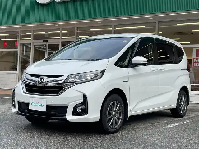 ホンダ フリード ハイブリット G ホンダセンシング 岐阜県 2017(平29)年 9.8万km ホワイトオーキッドパール ワンオーナー/4WD/両側パワースライドドア/後席モニター/ナビ/【Bluetooth．CD.TV.AM/FM】/バックカメラ/レザーシート/シートヒーター/コーナーセンサー/衝突被害軽減システム/レーンキープアシスト/クルーズコントロール/ETC/ドライブレコーダー/純正フロアマット/電動格納ドアミラー/ウィンカーミラー/ドアバイザー/サンシェード/横滑り防止装置/保証書/取扱説明書/スペアキー