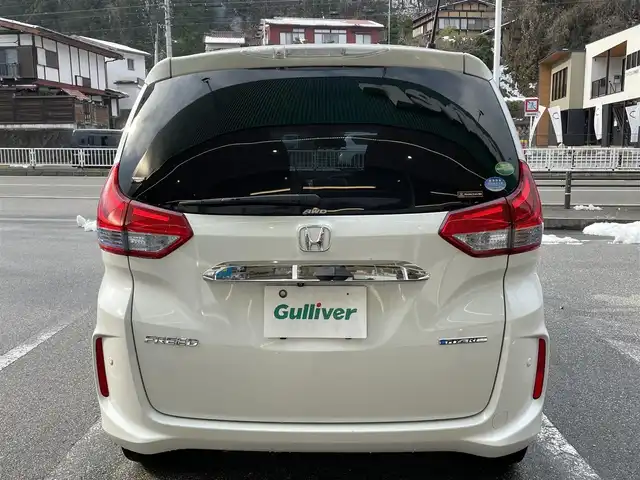 ホンダ フリード ハイブリット G ホンダセンシング 岐阜県 2017(平29)年 9.8万km ホワイトオーキッドパール ワンオーナー/4WD/両側パワースライドドア/後席モニター/ナビ/【Bluetooth．CD.TV.AM/FM】/バックカメラ/レザーシート/シートヒーター/コーナーセンサー/衝突被害軽減システム/レーンキープアシスト/クルーズコントロール/ETC/ドライブレコーダー/純正フロアマット/電動格納ドアミラー/ウィンカーミラー/ドアバイザー/サンシェード/横滑り防止装置/保証書/取扱説明書/スペアキー