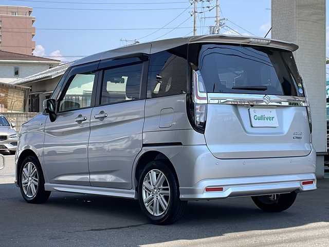 スズキ ソリオ HV MZ 愛知県 2021(令3)年 0.7万km スターシルバーメタリック 両側パワースライドドア/純正メモリナビ(フルセグTV/CD/DVD/AM・FM/BT/USB/AppleCarPlay/AndroidAuto)/アラウンドビューモニター/ETC/前席シートヒーター/ヘッドアップディスプレイ(HUD)/クリアランスソナー/クルーズコントロール/レーンアシスト/LEDヘッドライト/純正15インチアルミホイール/純正フロアマット/スペアキー/取扱説明書/保証書
