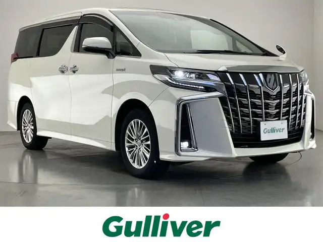 トヨタ アルファードハイブリット SR Cパッケージ 愛知県 2021(令3)年 2.1万km ラグジュアリーホワイトパールクリスタルシャインガラスフレーク 純９型ナビ　サンルーフ　デジイン　３眼ＬＥＤ　純１２型後席モニター　黒革　ＢＳＭ　バックカメラ　ＤＶＤ　エアシート　セーフティセンス　衝突軽減　追従クルコン　ＥＴＣ２．０　両側パワスラ　電動リヤゲート　デジタルインナーミラー　ツインムーンルーフ　後席エアコン　フリップダウンモニター　オートハイビーム　nanoe ステアリングヒーター　シートヒーター　カーテンエアバッグ　純正フロアマット　Bluetooth