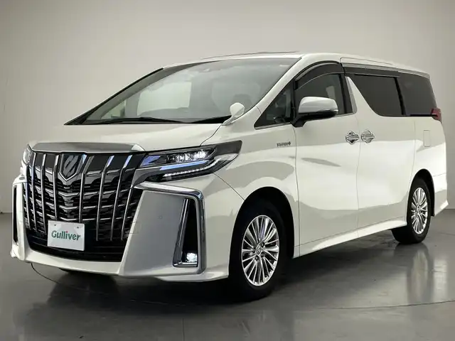 トヨタ アルファードハイブリット SR Cパッケージ 愛知県 2021(令3)年 2.1万km ラグジュアリーホワイトパールクリスタルシャインガラスフレーク 純９型ナビ　サンルーフ　デジイン　３眼ＬＥＤ　純１２型後席モニター　黒革　ＢＳＭ　バックカメラ　ＤＶＤ　エアシート　セーフティセンス　衝突軽減　追従クルコン　ＥＴＣ２．０　両側パワスラ　電動リヤゲート　デジタルインナーミラー　ツインムーンルーフ　後席エアコン　フリップダウンモニター　オートハイビーム　nanoe ステアリングヒーター　シートヒーター　カーテンエアバッグ　純正フロアマット　Bluetooth
