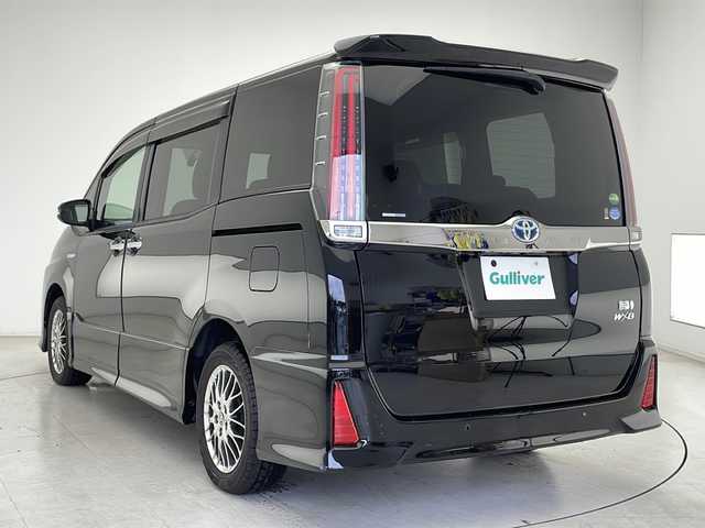 トヨタ ノア ハイブリッド Si ダブルバイビーⅡ 千葉県 2019(令1)年 2.3万km ブラック 禁煙車/純正１０インチSDナビ（フルセグTV/CD/DVD/BT/SD）/バックカメラ/前後ドライブレコーダー/トヨタセーフティーセンス/衝突軽減ブレーキ/レーンキープアシスト/オートハイビーム/クルーズコントロール/LEDヘッドライト/両側パワースライドドア/ステアリングスイッチ/アイドリングスイップ/ビルトインETC/純正フロアマット/純正ドアバイザー/ウィンカーミラー/フォグライト