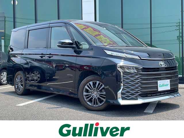 トヨタ ヴォクシー S－G 福岡県 2022(令4)年 5万km アティチュードブラックマイカ 禁煙車/Toyota Safety Sense/・プリクラッシュセーフティ/・レーントレーシングアシスト/・レーダークルーズコントロール/・ロードサインアシスト/・発進遅れ告知機能/・プロアクティブドライビングアシスト/・オートマチックハイビーム/10.5インチディスプレイオーディオ（ナビあり）/Bluetooth.Miracast.HDMI/CD.DVDデッキ/バックカメラ/フルセグ/両側パワースライドドア/シートヒーター/電動パーキングブレーキ/オートホールド/ETC2.0/横滑り防止/プッシュスタート/スマートキー/ヘッドライトレベライザー