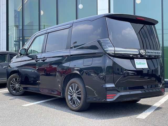 トヨタ ヴォクシー S－G 福岡県 2022(令4)年 5万km アティチュードブラックマイカ 禁煙車/Toyota Safety Sense/・プリクラッシュセーフティ/・レーントレーシングアシスト/・レーダークルーズコントロール/・ロードサインアシスト/・発進遅れ告知機能/・プロアクティブドライビングアシスト/・オートマチックハイビーム/10.5インチディスプレイオーディオ（ナビあり）/Bluetooth.Miracast.HDMI/CD.DVDデッキ/バックカメラ/フルセグ/両側パワースライドドア/シートヒーター/電動パーキングブレーキ/オートホールド/ETC2.0/横滑り防止/プッシュスタート/スマートキー/ヘッドライトレベライザー